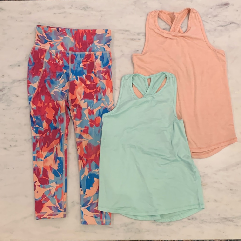 Girls activewear- size small (6-7). One pair of leggings with two tank tops.